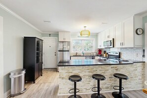 Fridge, microwave, oven, stovetop - Newly renovated lagoon-view home with screen porch & patio - short walk to beach (Edisto Beach)