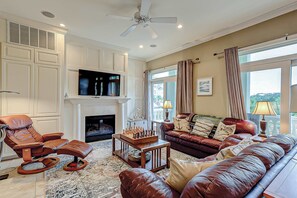 TV, fireplace - Beachfront beauty with pool access - fireplaces, jetted tub, balconies, & W/D (Hilton Head)