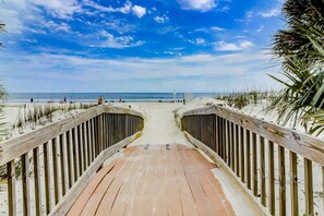 A wooden boardwalk leading to a beach with a clear sky. - Hilton Head Resort Villa with pools, hot tub, golf, sports courts and beach access (Hilton Head)