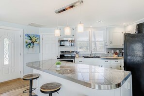 Fridge, microwave, oven, stovetop - Sunny beach house with ocean view, large deck, central AC, & washer/dryer (Edisto Beach)