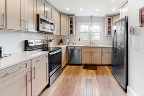 Fridge, microwave, oven, stovetop - Newly Renovated, Dog-Friendly Home w/ Ocean View, Decks, WiFi - Walk to Beach (Edisto Beach)
