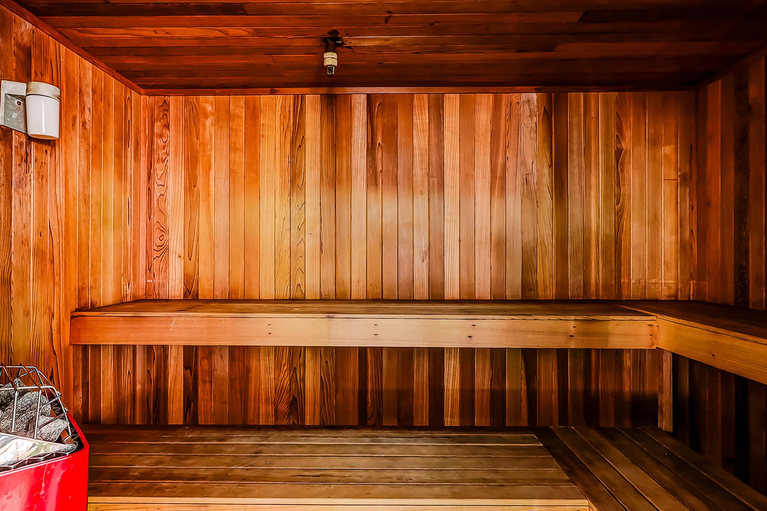 A sauna with wooden walls and benches.