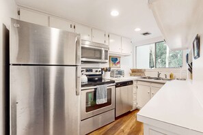 Fridge, microwave, oven, stovetop - Coastal condo with private grill and shared pool, nearby beach access (Hilton Head)