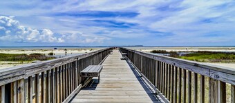 Condo by the beach with heated pools, hot tub, patio, tennis, central AC, & W/D