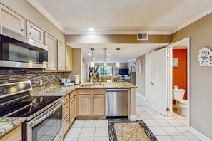Fridge, microwave, oven, stovetop - Lagoon waterfront villa with pools, hot tub, & gym - walk to beach (Hilton Head)