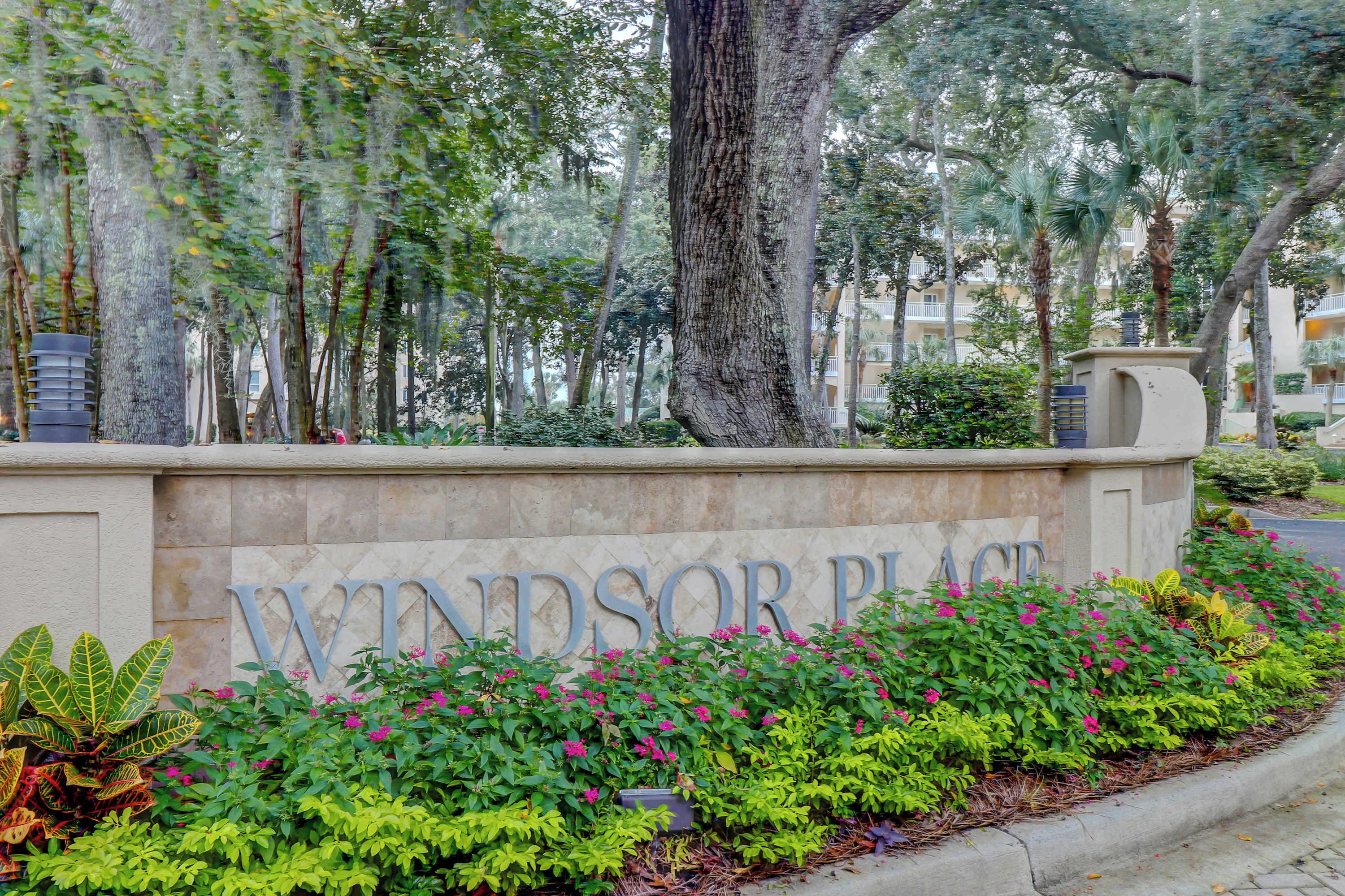 A sign for 'Windsor Place' with a landscaped area in front.