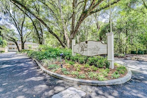 A sign for The Spa on Port Royal Sound with a landscaped garden area.