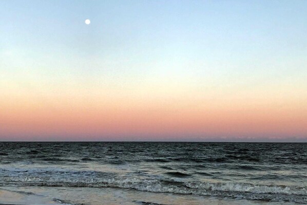 A beach with waves and a moon in the sky. - Conveniently Located Vacation Condo with Shared Pool & Tennis Court, Free WiFi, AC (Hilton Head)