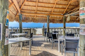 Outdoor dining - Updated oceanfront villa with amazing views, balcony, pool access & W/D (Hilton Head)