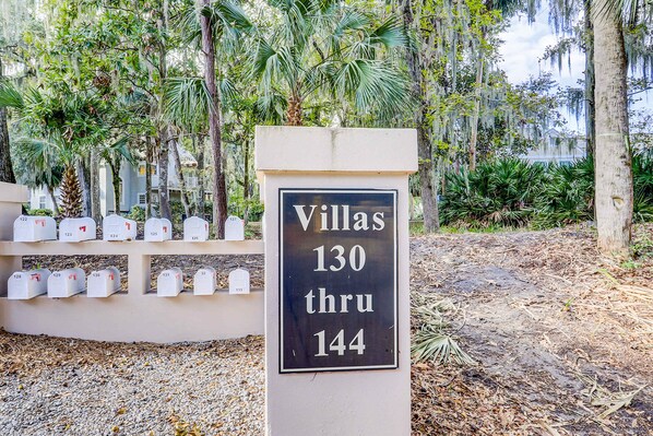 A sign indicating Villas 130 through 144. - Charming French Inspired Villa, Dog Friendly Retreat with Patio, Pool & Tennis (Hilton Head)