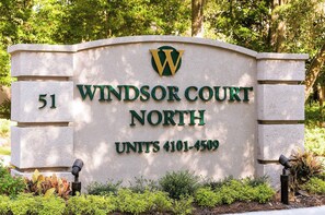 A sign for Windsor Court North with a W logo, indicating a hotel or residential complex. - Island getaway by the ocean with balcony view & shared pool and beach access (Hilton Head)