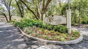 A sign for 'The Fauna On Port Royal Sound' with a landscaped garden in the foreground. - Vibrant condo with tennis courts, pool, WD, gas grill, balcony, & playground (Hilton Head)