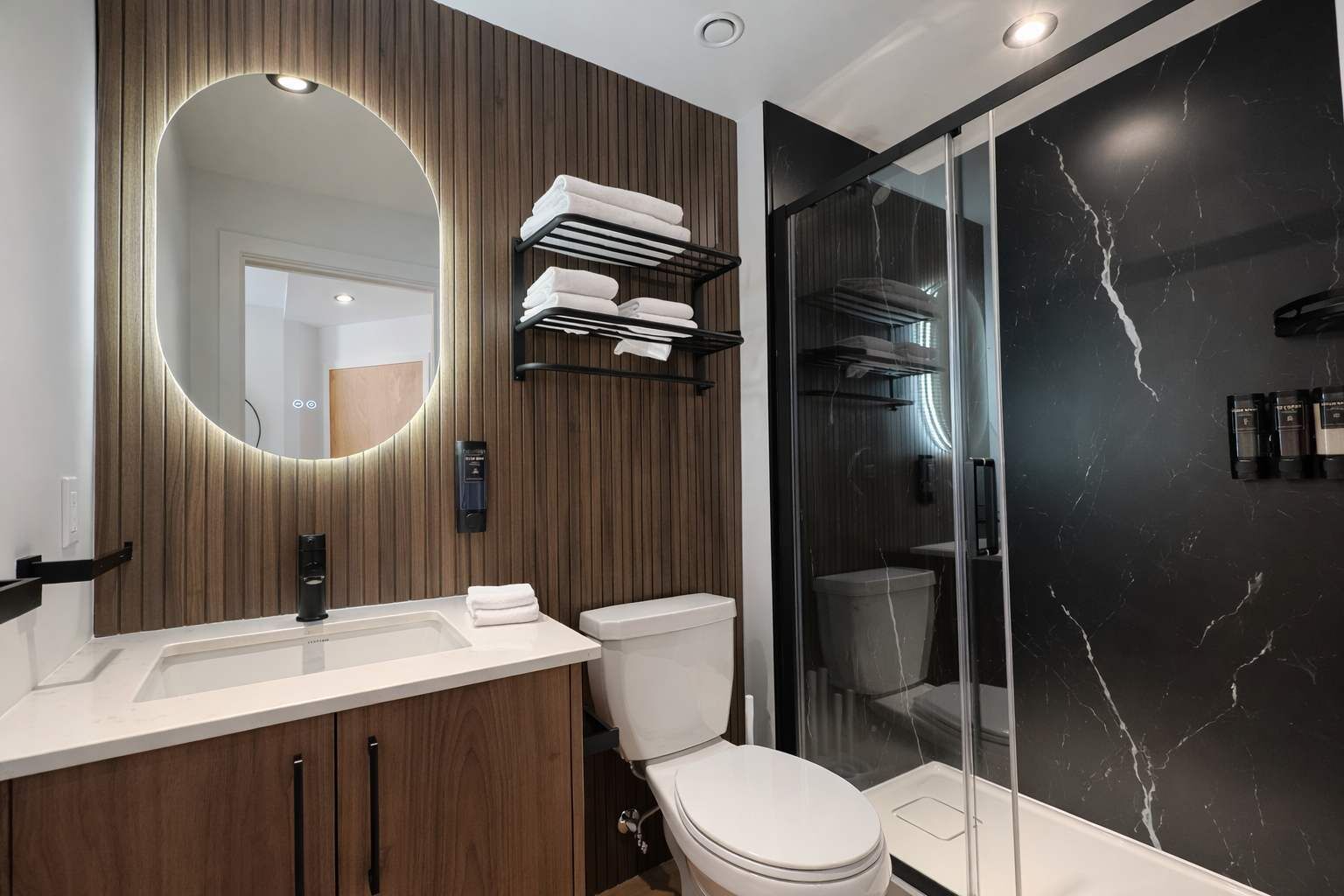 Shower, hair dryer, towels, shampoo