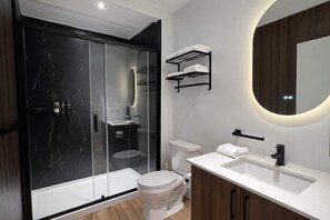 Shower, hair dryer, towels, shampoo
