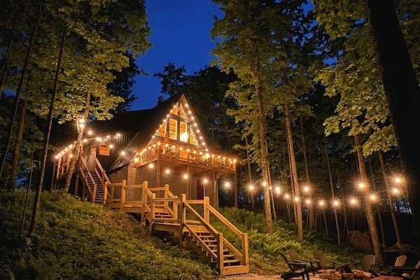 Arrive to your private A-frame retreat lit up under the Red River Gorge sky