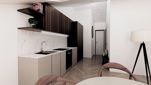 Une cuisine moderne dotée d’un plan de travail en marbre, d’une cuisinière encastrée et de meubles de rangement aux couleurs sombres.