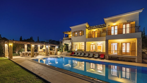 A two-story house with a swimming pool, outdoor seating, and a covered patio area. - Villa 151 Luxury Villa - Private Pool and Tennis Court (Kouklia)