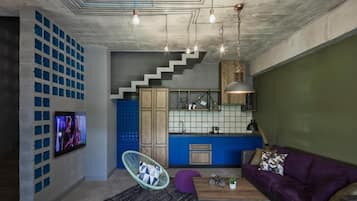 Family Quadruple Room, Balcony, Garden View | Living area