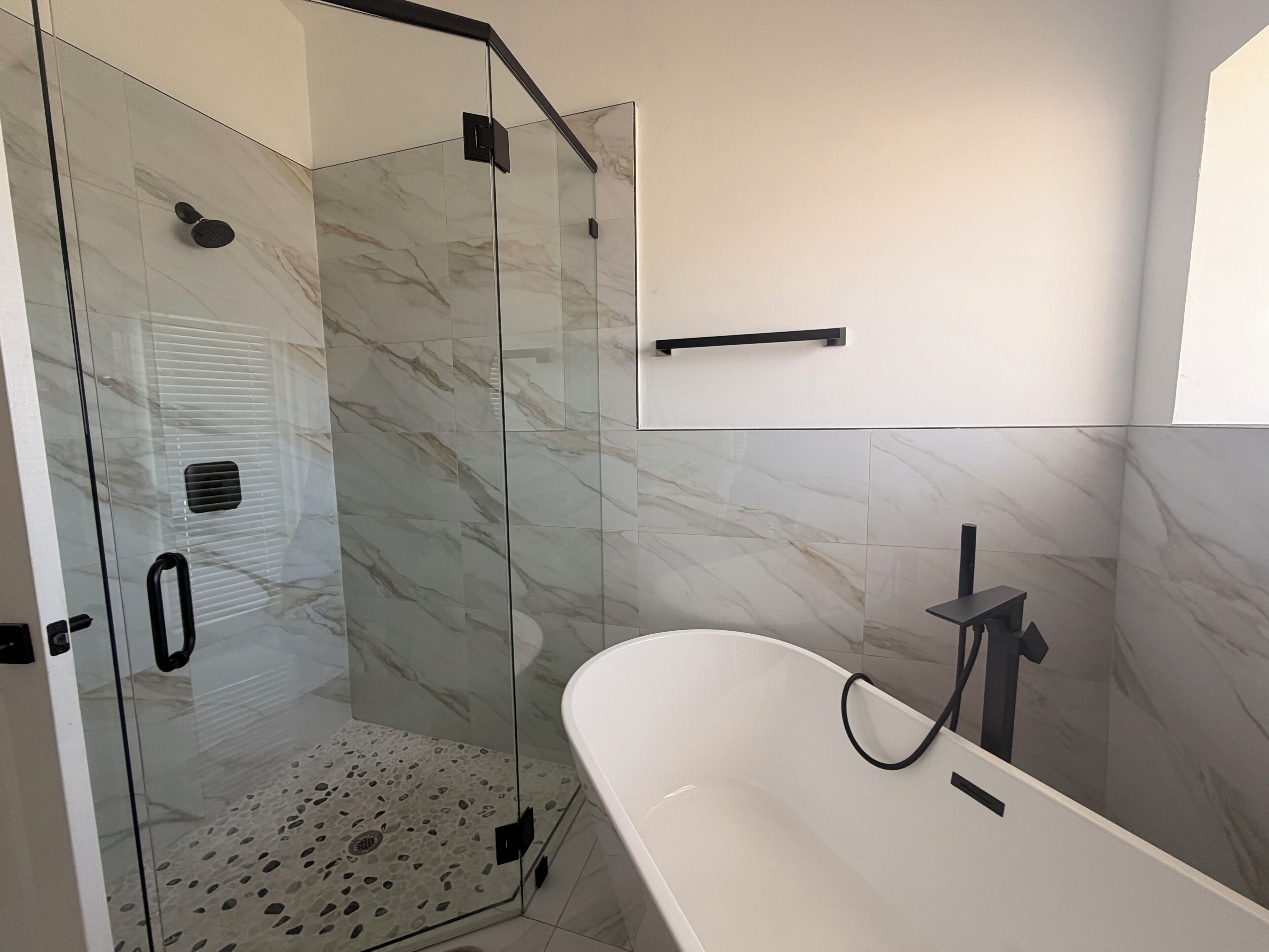 Shower, hair dryer, towels, toilet paper