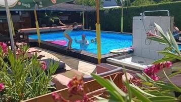 Seasonal outdoor pool, open 9:00 AM to 7:30 PM, pool umbrellas