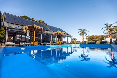 Cozy 3-bedroom cottage in peaceful Mielno with AC, Heated Swimming Pool