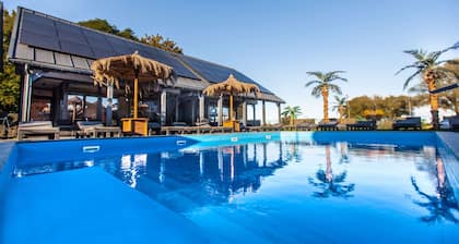 Cozy 3-bedroom cottage in peaceful Mielno with AC, Heated Swimming Pool