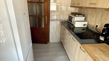 Loftsleilighet, balkong, byutsikt | Eget kjøkken