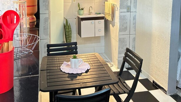 A compact kitchen with a tiled backsplash, a built-in sink, and a small countertop. - A haven of tranquility, a house close to the center of São Lourenço. (São Lourenço)