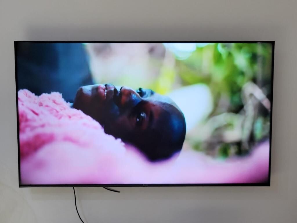 A flat-screen TV mounted on a wall.