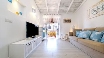 Departamento tradicional, balcón, vista al mar | Área de sala de estar