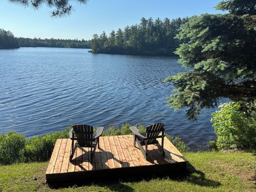 West Arm cottage with panoramic views, boathouse