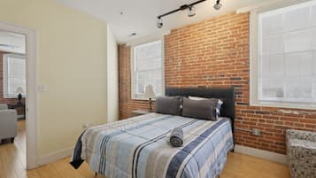 1 bedroom, desk, iron/ironing board, travel crib