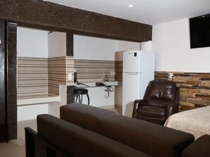 Habitación cuádruple Confort | Área de sala de estar