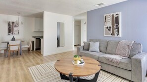 Apartment (2 Bedrooms) | Living area | 50-inch Smart TV with digital channels, fireplace - Landing Apartments Near CVC (DeSoto)