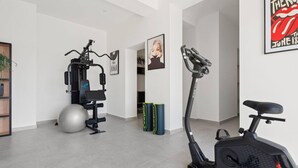 A home gym with exercise equipment, a standing bike, and a large exercise ball. - Estate With Jacuzzi, Gym (Omis)