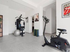 A home gym with exercise equipment, a standing bike, and a large exercise ball. - Estate With Jacuzzi, Gym (Omis)