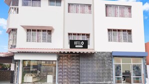 A two-story hotel with a sign reading 'HOTEL'.