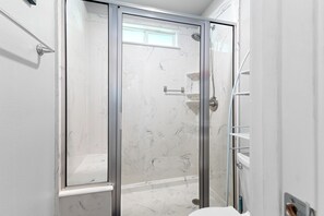 Shower, towels, soap, toilet paper