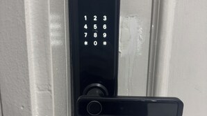 A modern door lock with a numeric keypad and a lever handle. - Self Checkin Studio - Olaya 203 (Riyadh)