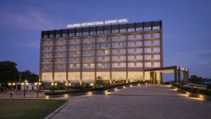 A large hotel with a modern facade, multiple floors, and a well-lit entrance. - colombo international airport hotel (Katunayake)