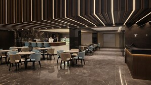 A modern interior with a bar area, seating, and a reception desk. - colombo international airport hotel (Katunayake)