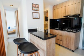 Apartamento luxo, sacada, vista para a montanha | Cozinha privada