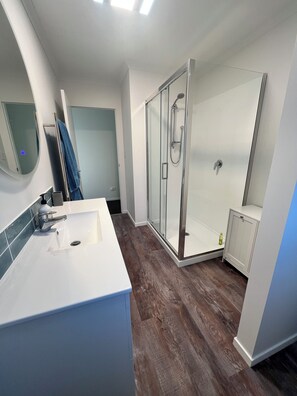 Shower, hair dryer, towels, soap