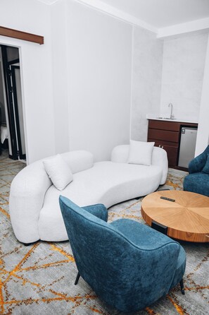 Junior Studio Suite, Mountain View | Living area | 65-inch Smart TV with digital channels - Timeless Morogoro (Morogoro)