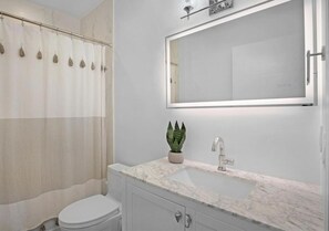 Jetted bath, hair dryer, bidet, towels