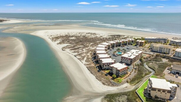 An aerial view of a coastal hotel with multiple buildings, a beach, and a clear view of the ocean. - Inlet Point Villas 11D - Pool View (North Myrtle Beach)