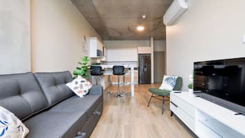 City Suite, City View | Living area | 60-inch Smart TV with digital channels, streaming services