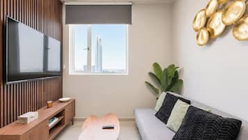 Business Suite, City View | Living area | 60-inch Smart TV with digital channels, streaming services