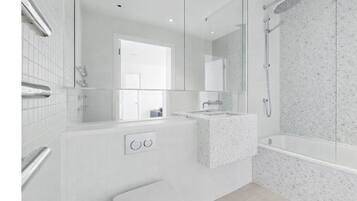 Shower, hair dryer, towels, toilet paper