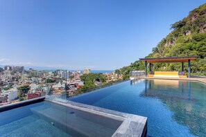 A heated pool - Oasis 408: Oasis Riverfront Luxury 2BR Infinity Pool & Views (Puerto Vallarta)